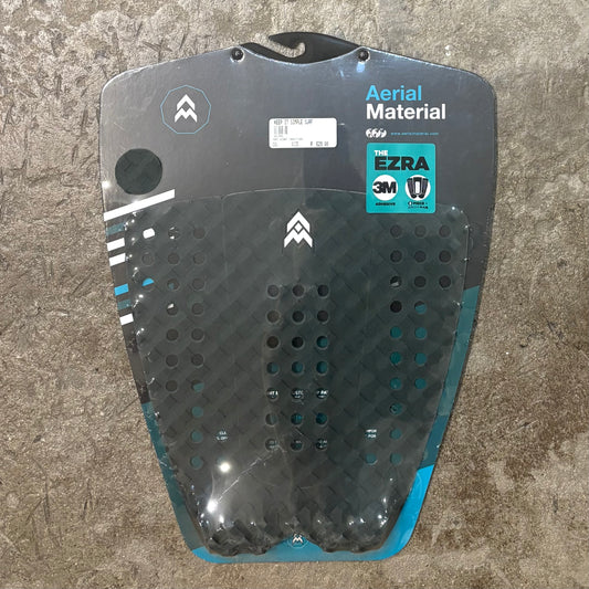 Aerial Material Ezra traction in green on concrete surface.