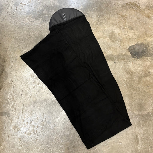 Black Longboard Stretchy Sox on a textured surface