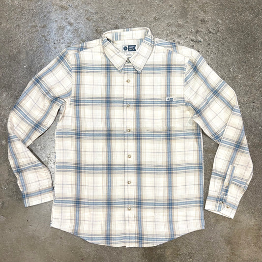 White t-shirt with graphic design on a concrete surface