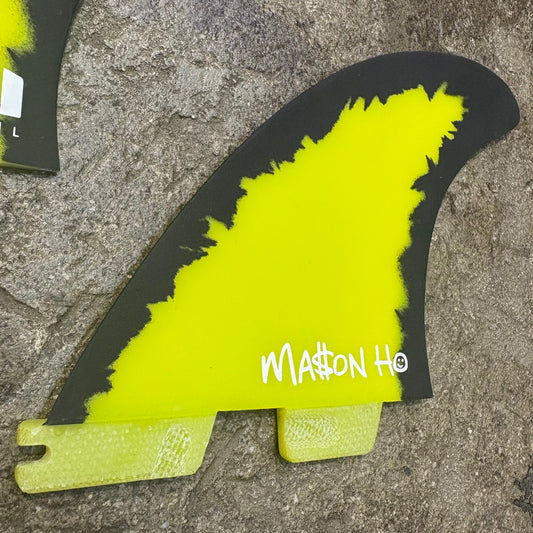 FCS II Mason Ho Signature Fin - Single fin lying on concrete floor - Bright Yellow and Black