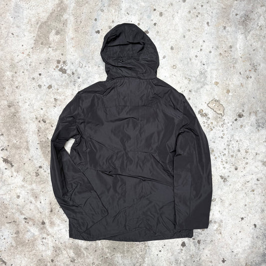 Black jacket on a textured concrete surface