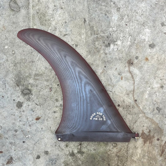 Surfboard fin on a concrete surface