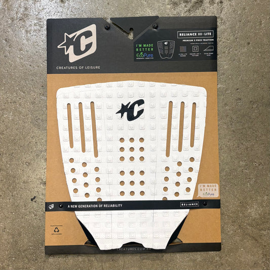 White textured pad with black logo on a brown and black packaging