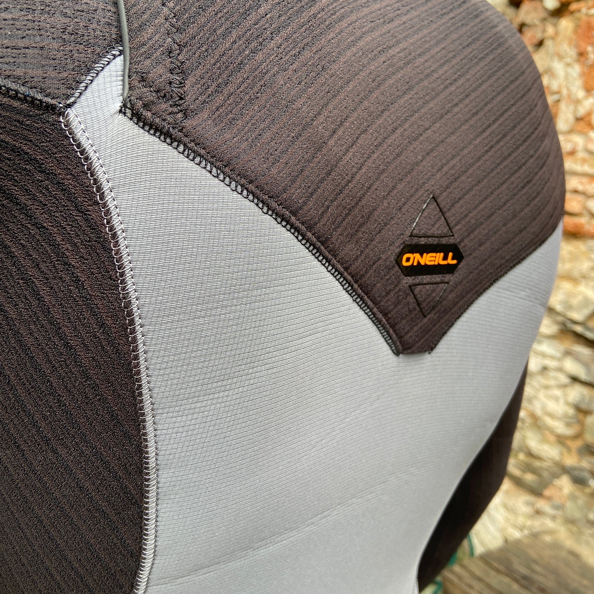 Detailed view of the back drainage hole on the O'Neill Hyperfreak 3/2mm+ Chest Zip - Smoke Raven - Men's Fullsuit