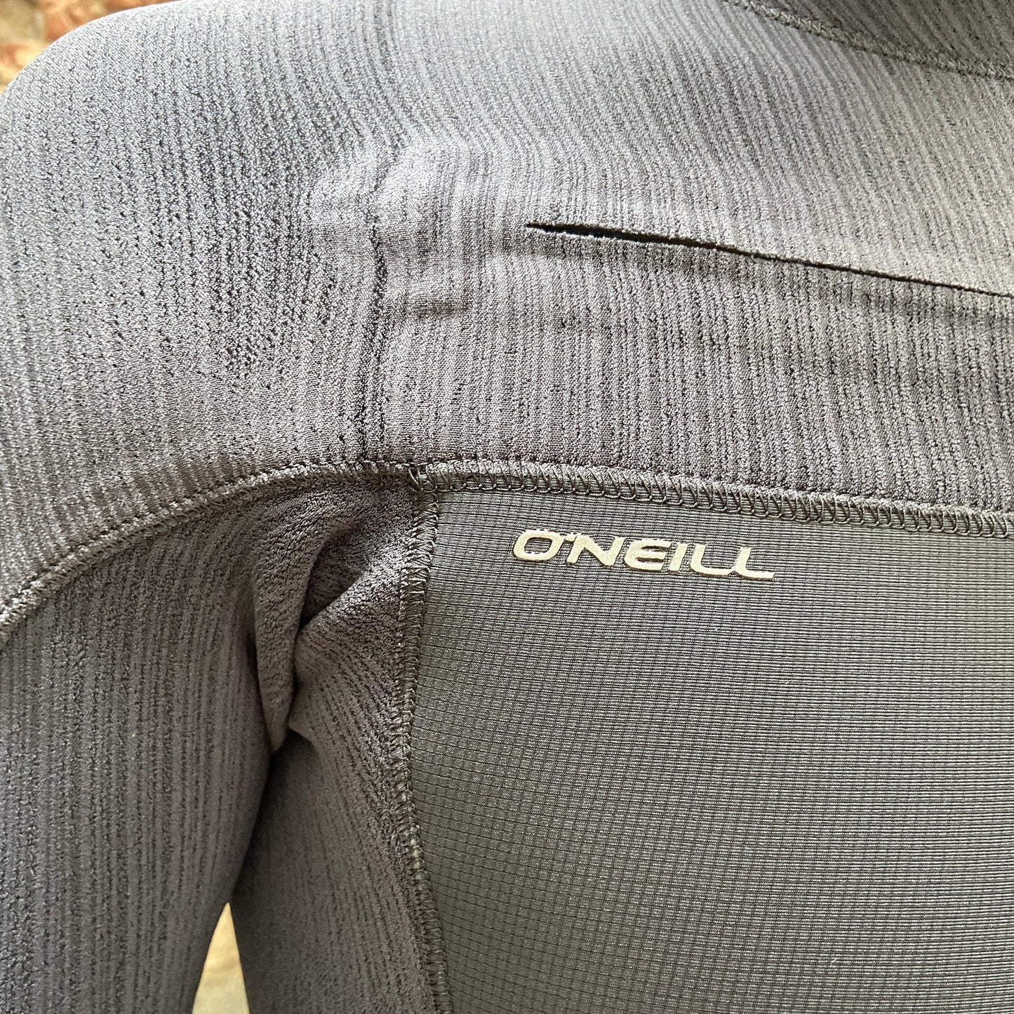 Detailed view of the zip closure on the O'Neill Hyperfreak 4/3mm+ Chest Zip - Black - Men's Full Wetsuit