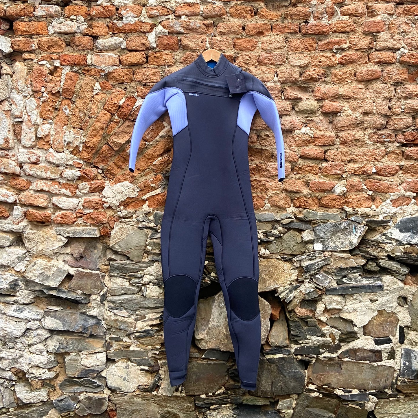 Front view of the O'Neill Woman's Hyperfreak Fuze 4/3mm+ Chest Zip Hung Up - Gunmetal/Lily - Ladies Full Suit
