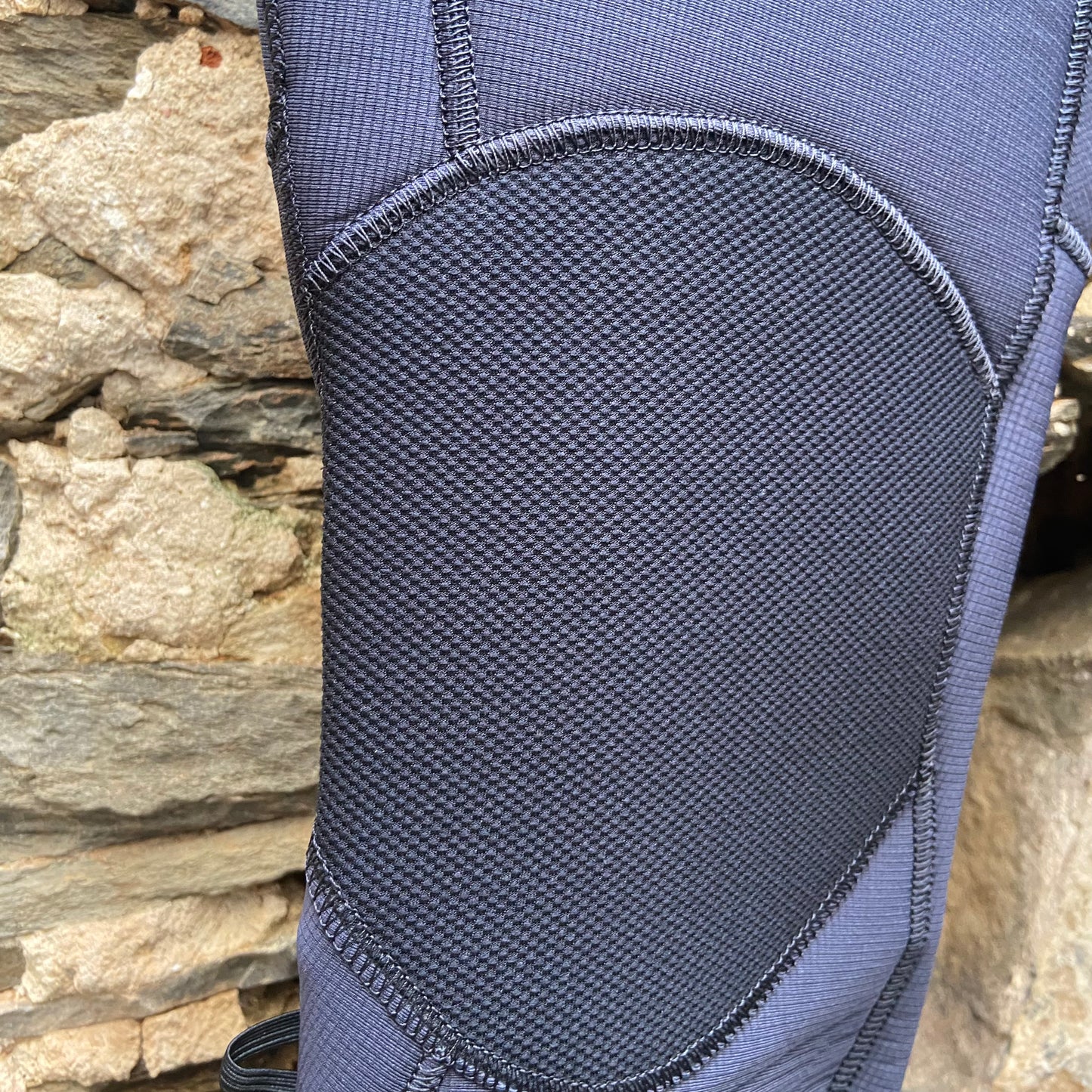 Detailed view of the knee pad on the O'Neill Woman's Hyperfreak Fuze 4/3mm+ Chest Zip - Gunmetal/Lily - Ladies Full Suit