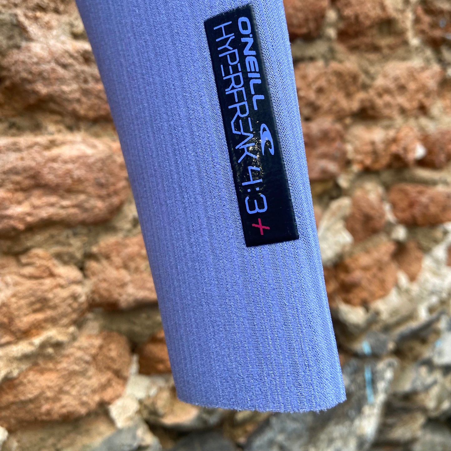 Detailed view of the sleeve on the O'Neill Woman's Hyperfreak Fuze 4/3mm+ Chest Zip - Gunmetal/Lily - Ladies Full Suit