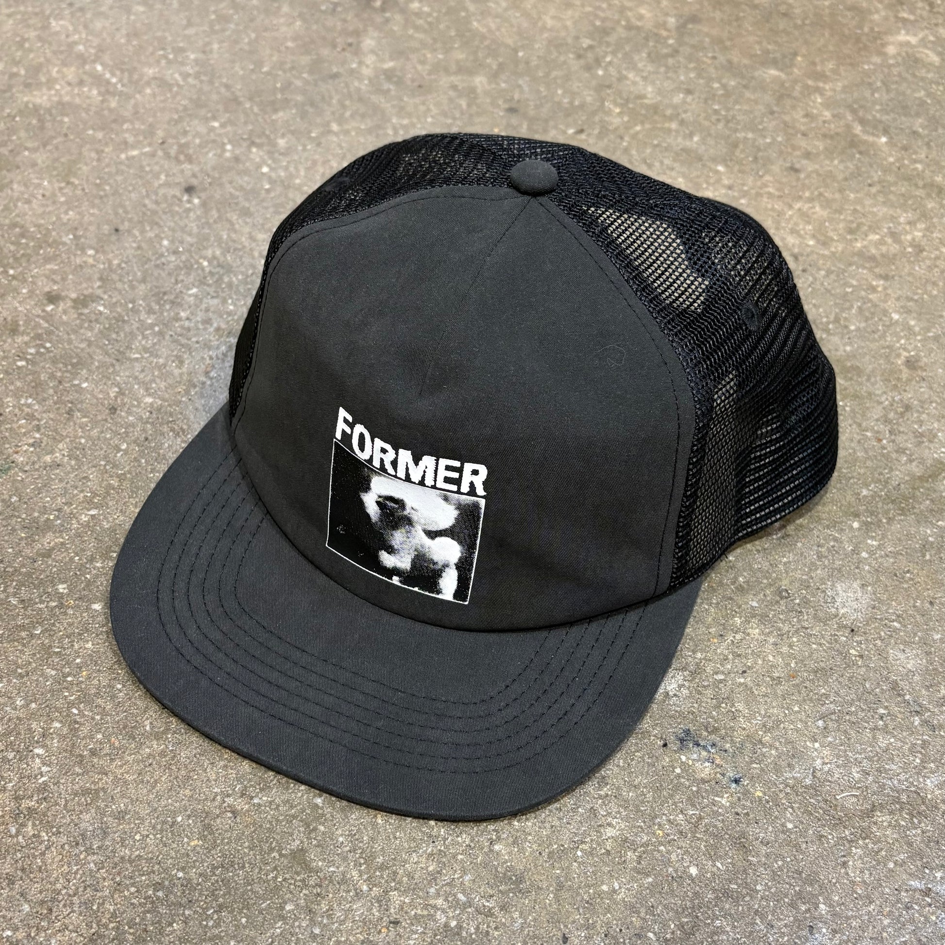 Front view or Former Merchandise War Poodle Trucker Cap