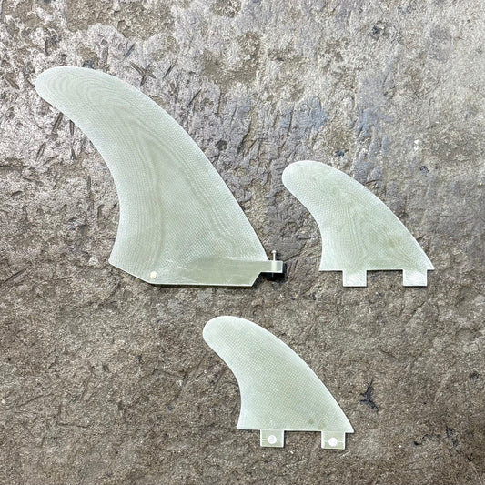 Front view of 6.5 SINGLE FIN + 4"  SIDE BITES FCS on concrete floor.