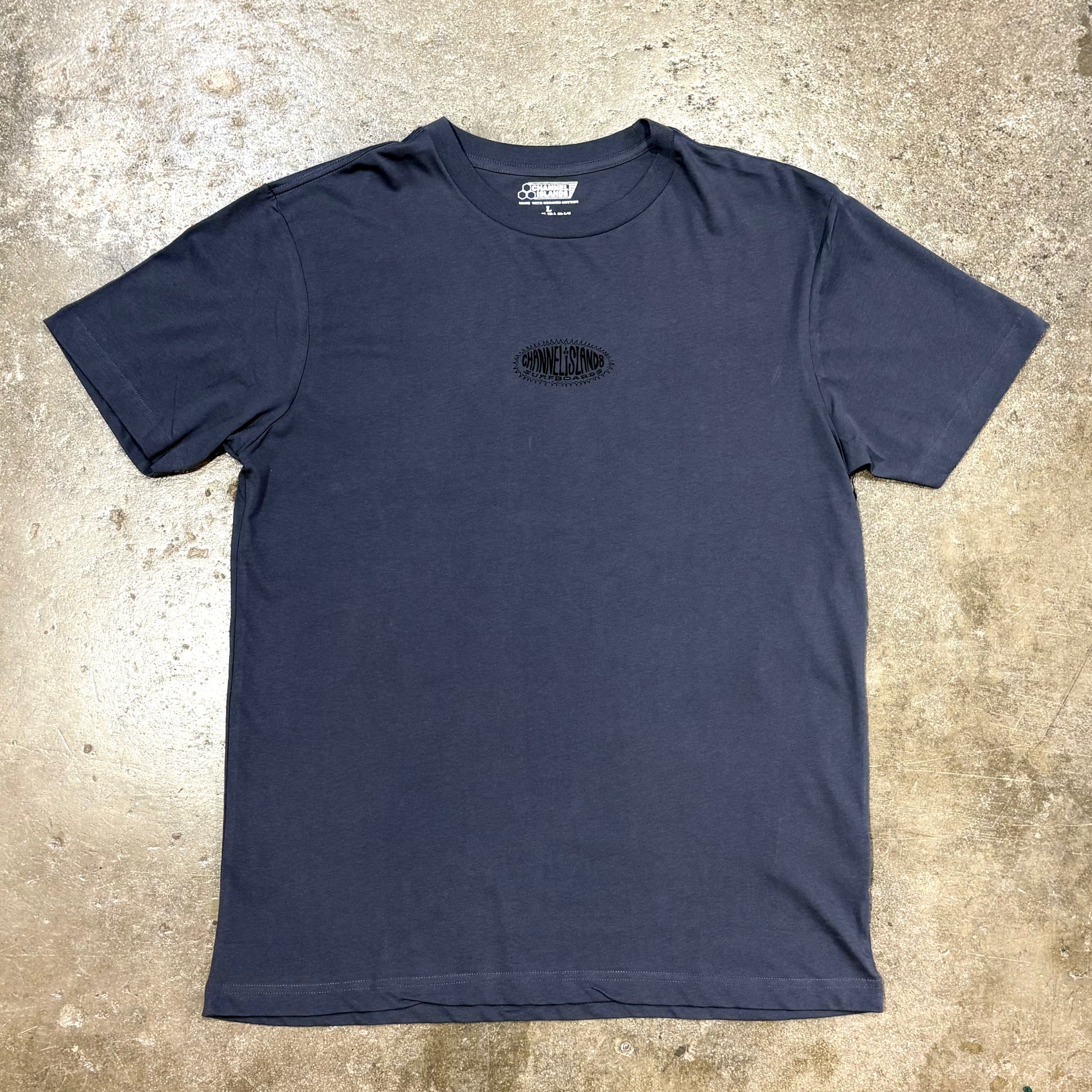 Blue Channel Islands T Shirt on a concrete surface
