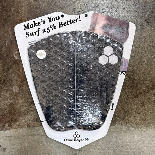 Dane Reynolds surf pad with text on a textured surface