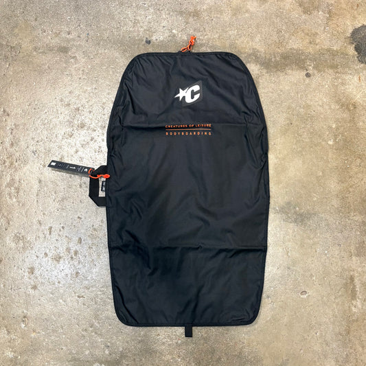 Black bag with a logo on a concrete surface