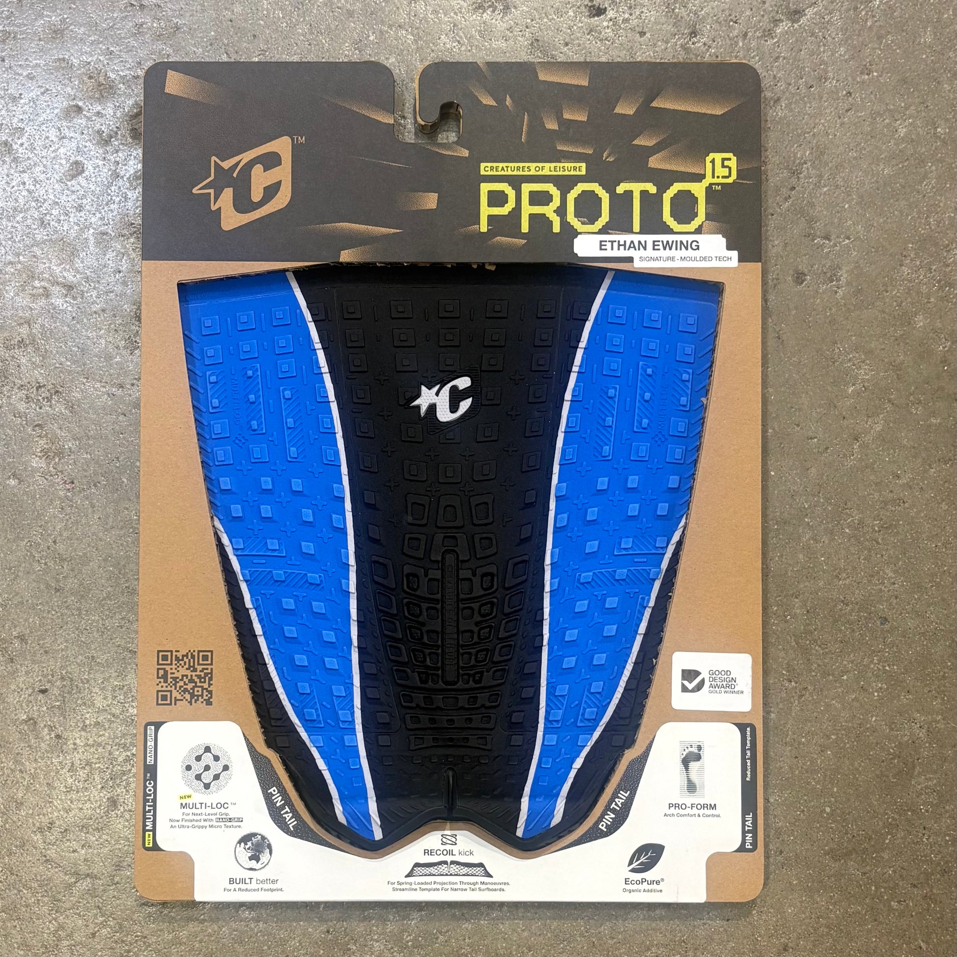 Package of a blue and black surf traction with visible branding on a textured surface