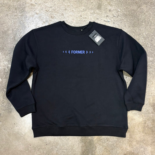 Black Crew with blue logo on concrete surface