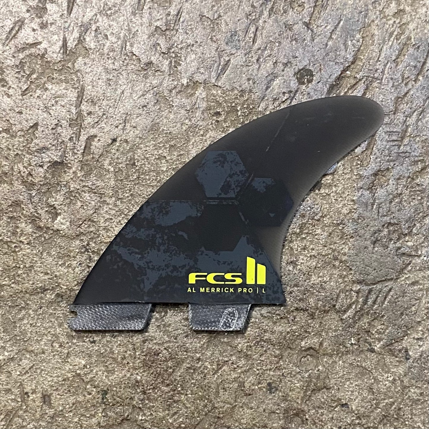 Middle fin from the FCS II Al Merrick PG Pro Tri Fin Set laid out