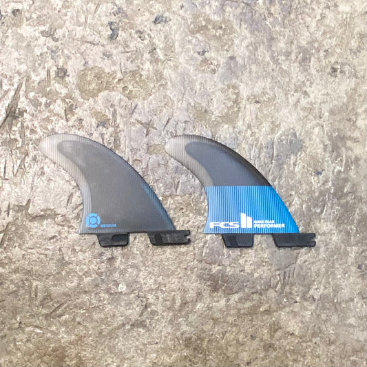A set of FCS II Performer PC Quad Rear M laid on a concrete floor