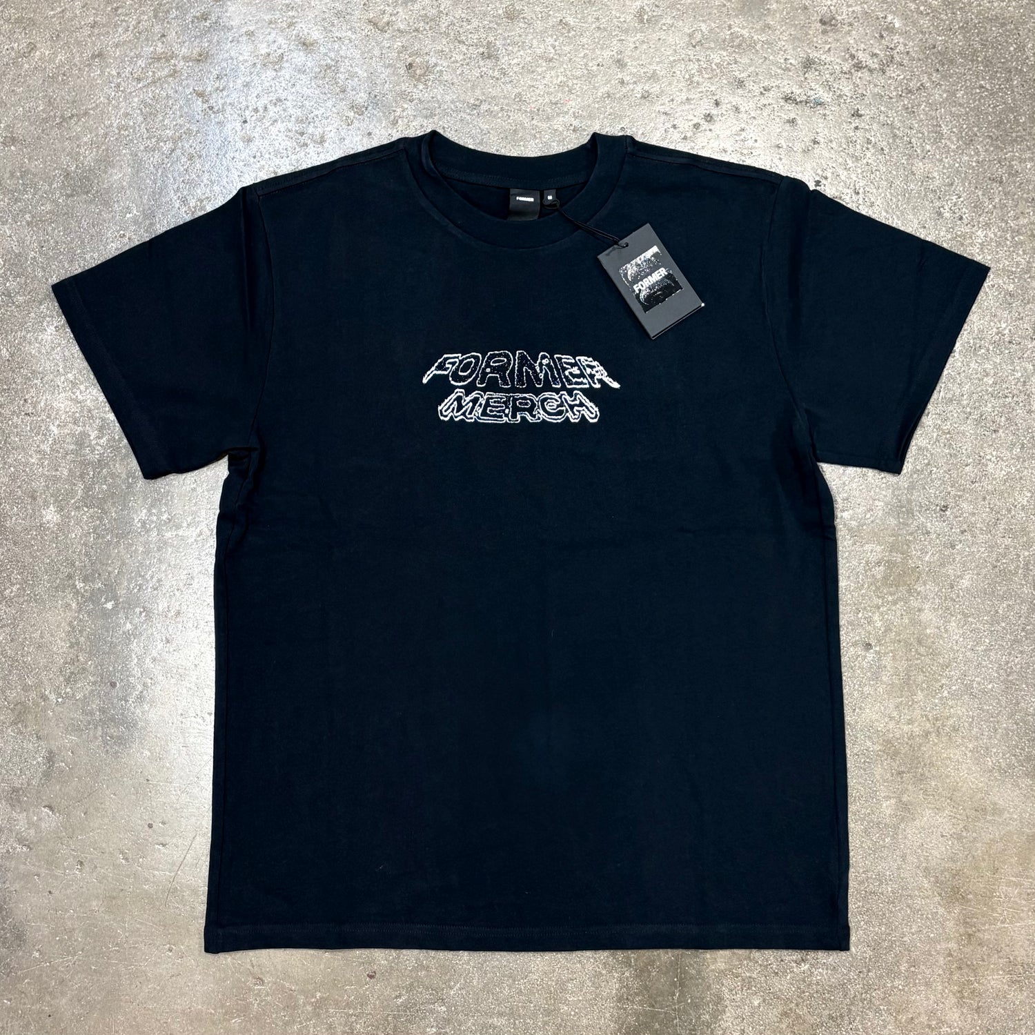 Front view of Former Marquee T Shirt in black