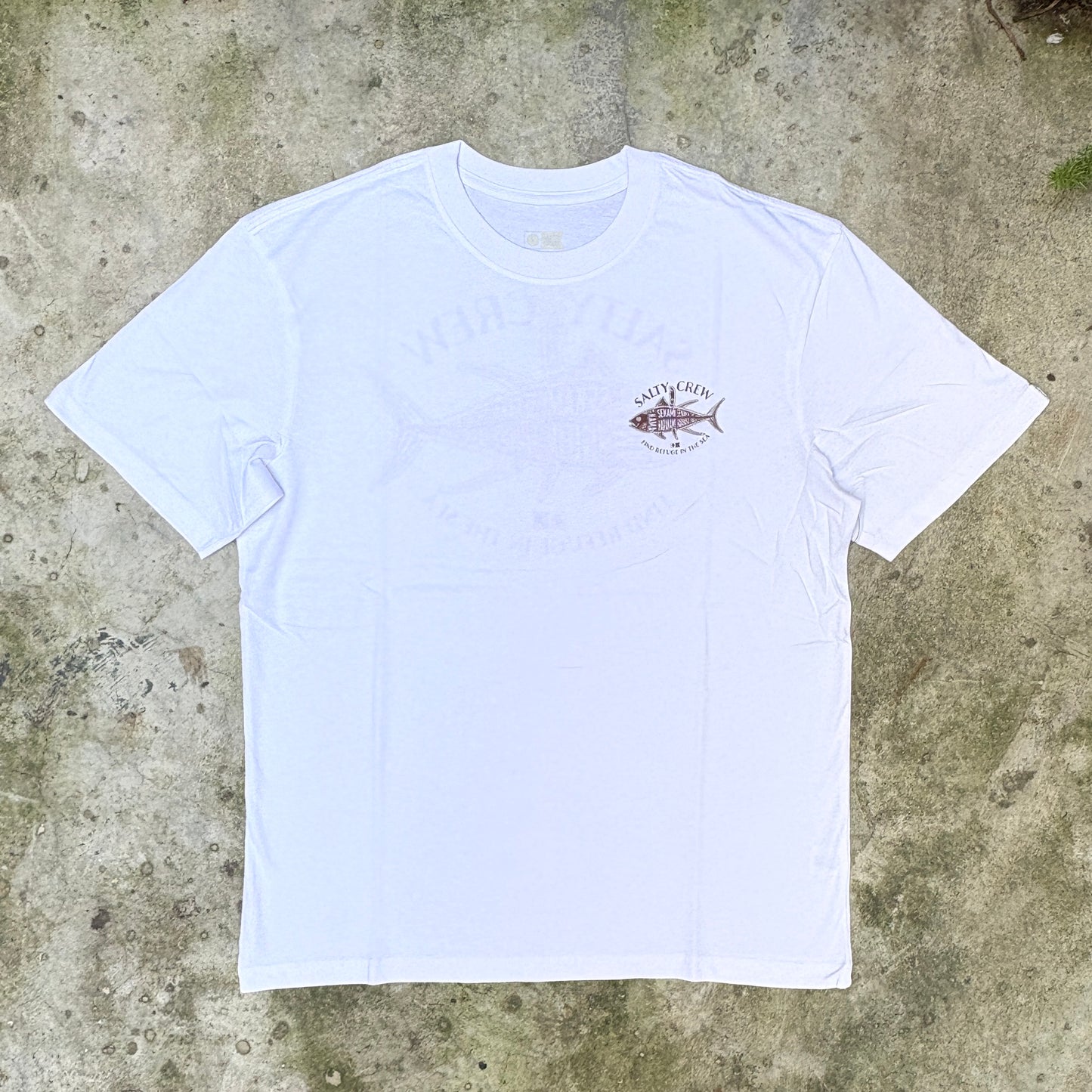 A white short-sleeve crewneck t-shirt with a small fish graphic and 'North Fish' branding on the left chest, laid flat on a textured concrete surface.