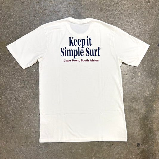 White t-shirt with 'Keep it Simple Surf' text on a textured gray background