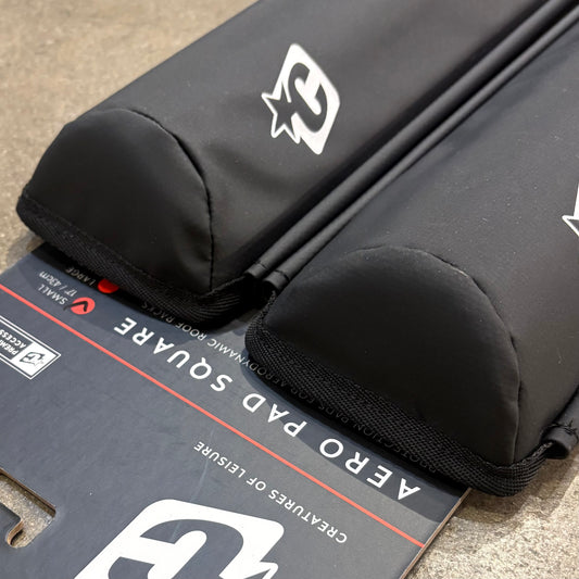Black protective pad with a brand logo on a cardboard box labeled 'Aero Pad Square'.