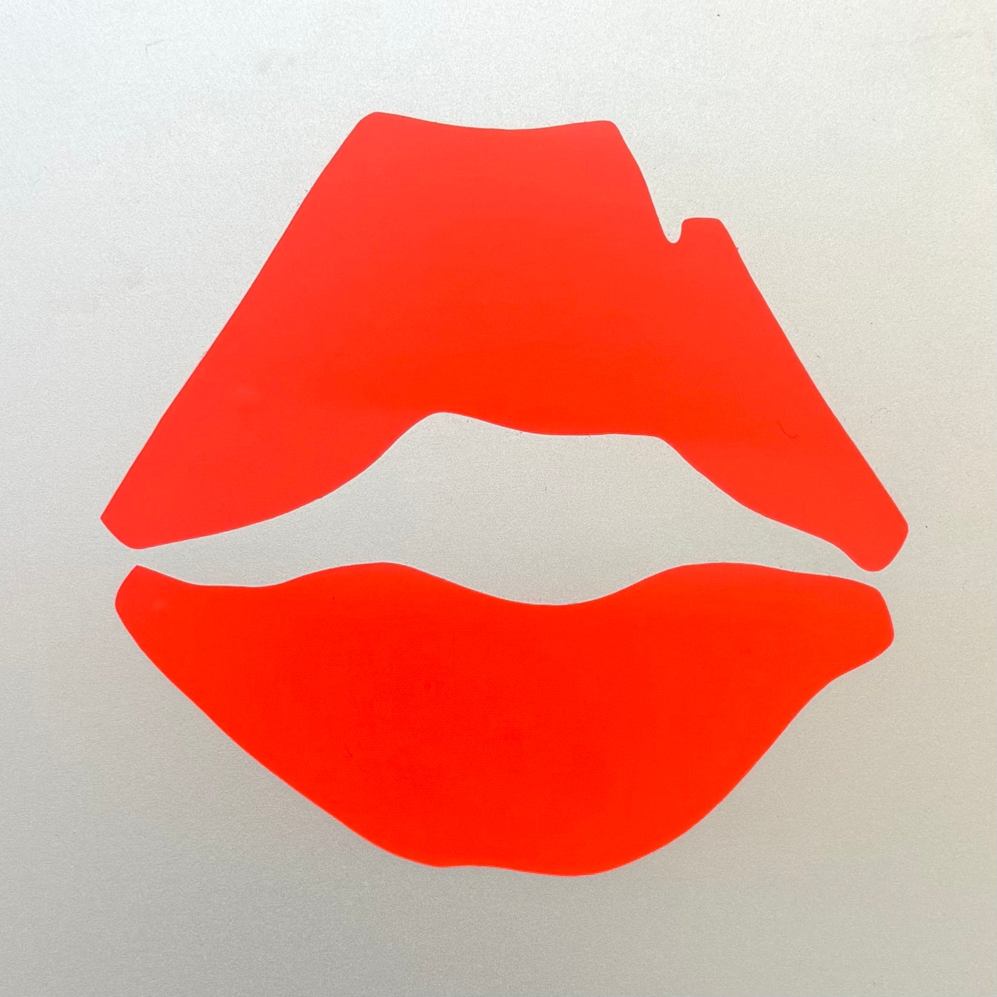 Red lips graphic on a white background