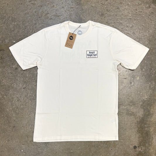 Ivory Kiss T-Shirt with logo on chest on concrete surface