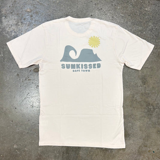 Dusty Pink t-shirt with grey graphic and 'Sunkissed Cape Town' text on a gray concrete surface