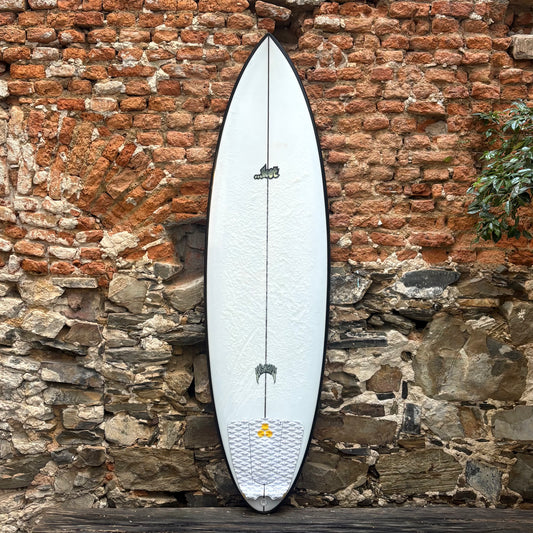 LOST BY MAYHEM  Surfboard Quiver Killer  6'4 against a stone wall