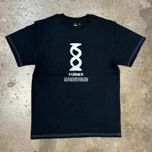 Black t-shirt with white graphic design on a concrete surface