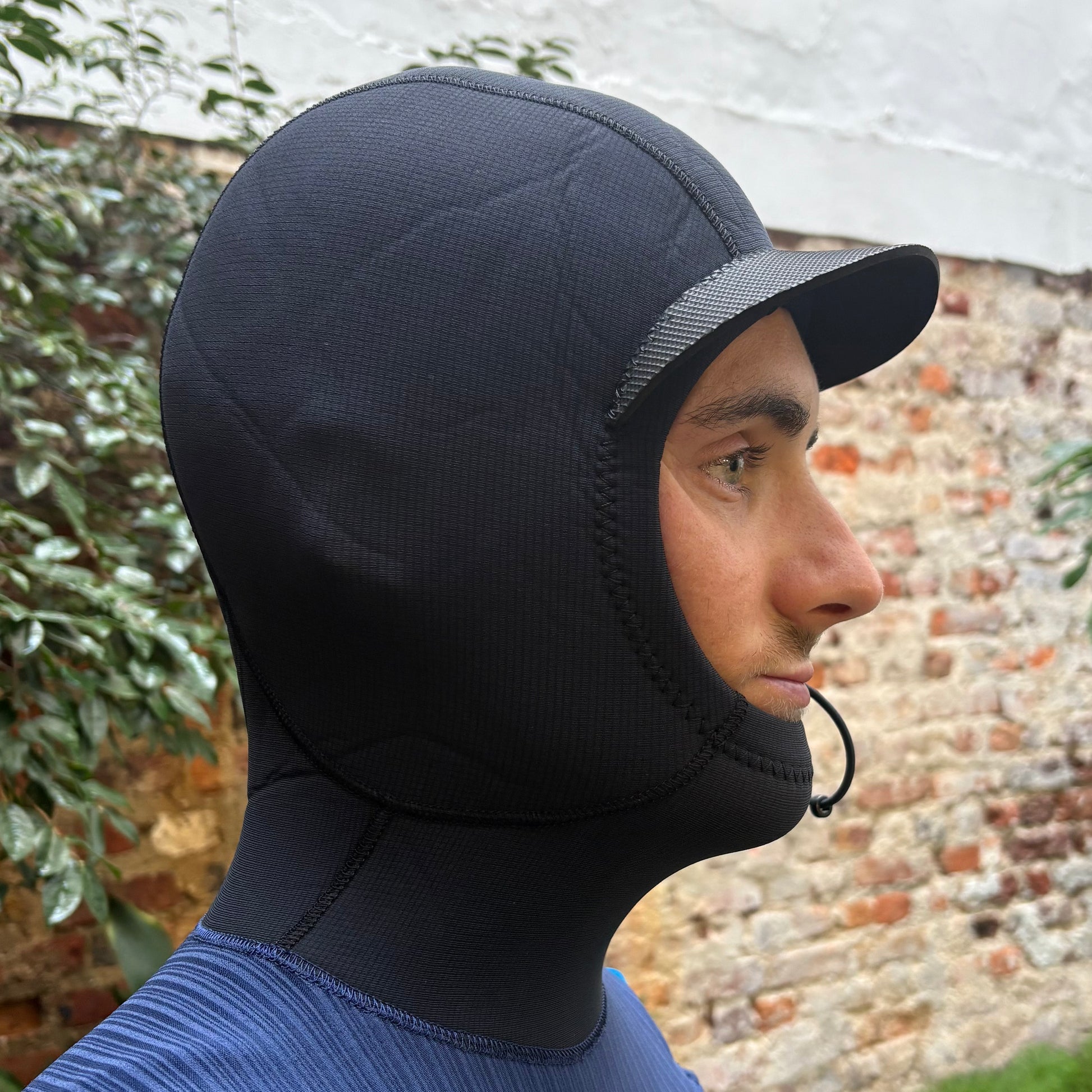 View of hood on O'Neill Hyperfreak 4/3+ Chest Zip Hooded worn by model- Hood with sun visor