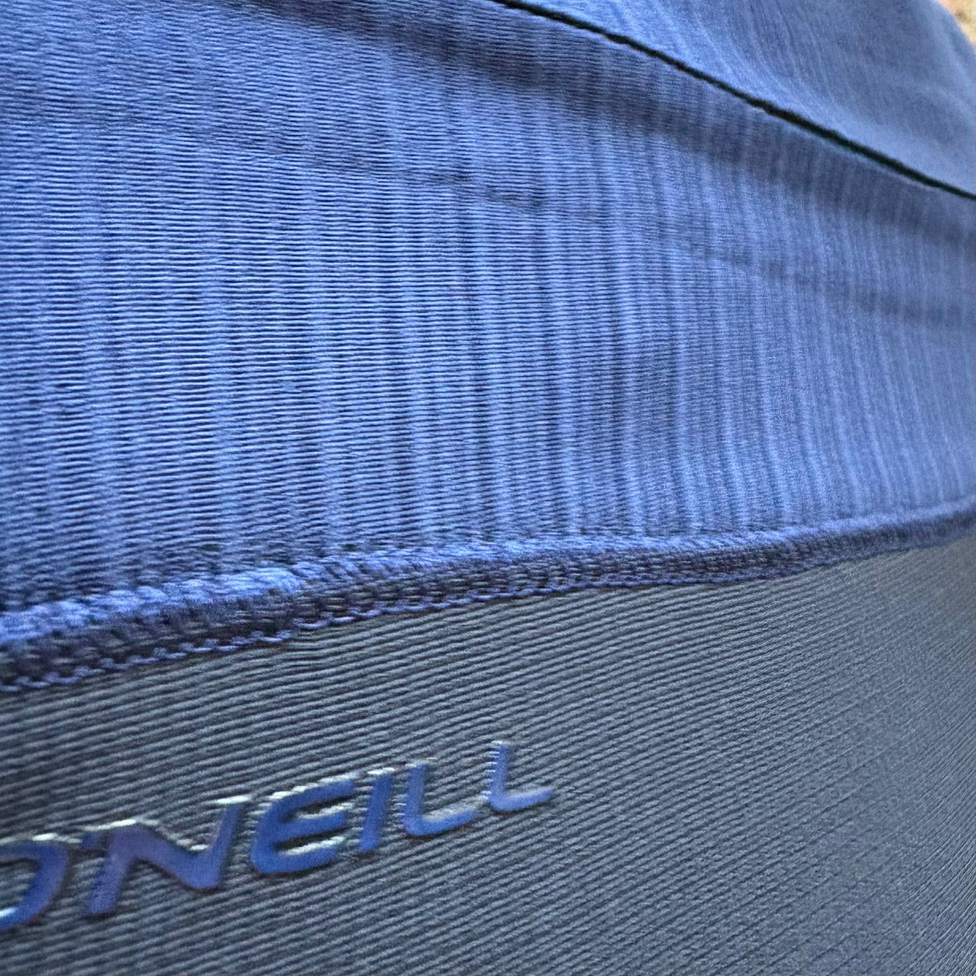View of Zip Closure on O'Neill Hyperfreak 4/3+ Chest Zip Hooded worn by model- Black and Navy Men's Wetsuit