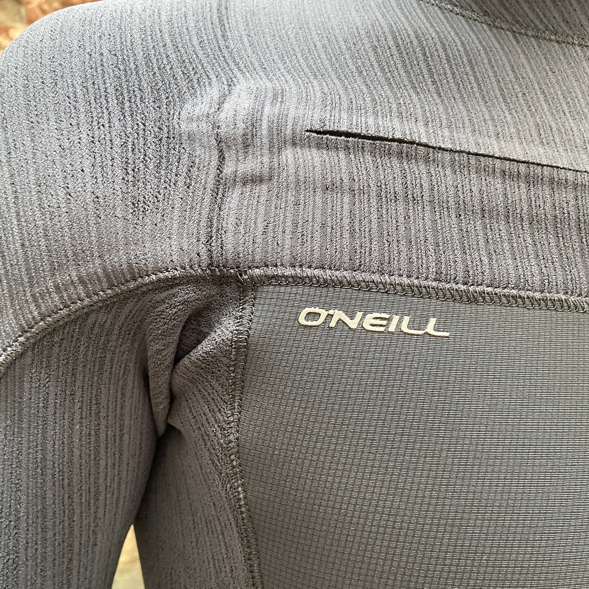Detailed view of the zip closure on the O'Neill Hyperfreak 4/3mm+ Chest Zip - Black - Men's Full Wetsuit