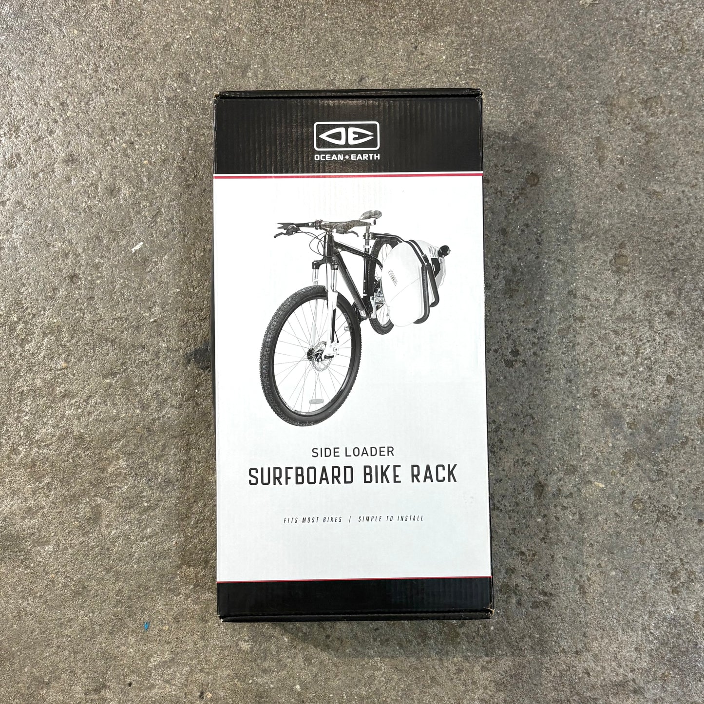 Box for a Ocean&Earth surfboard bike rack on a concrete surface
