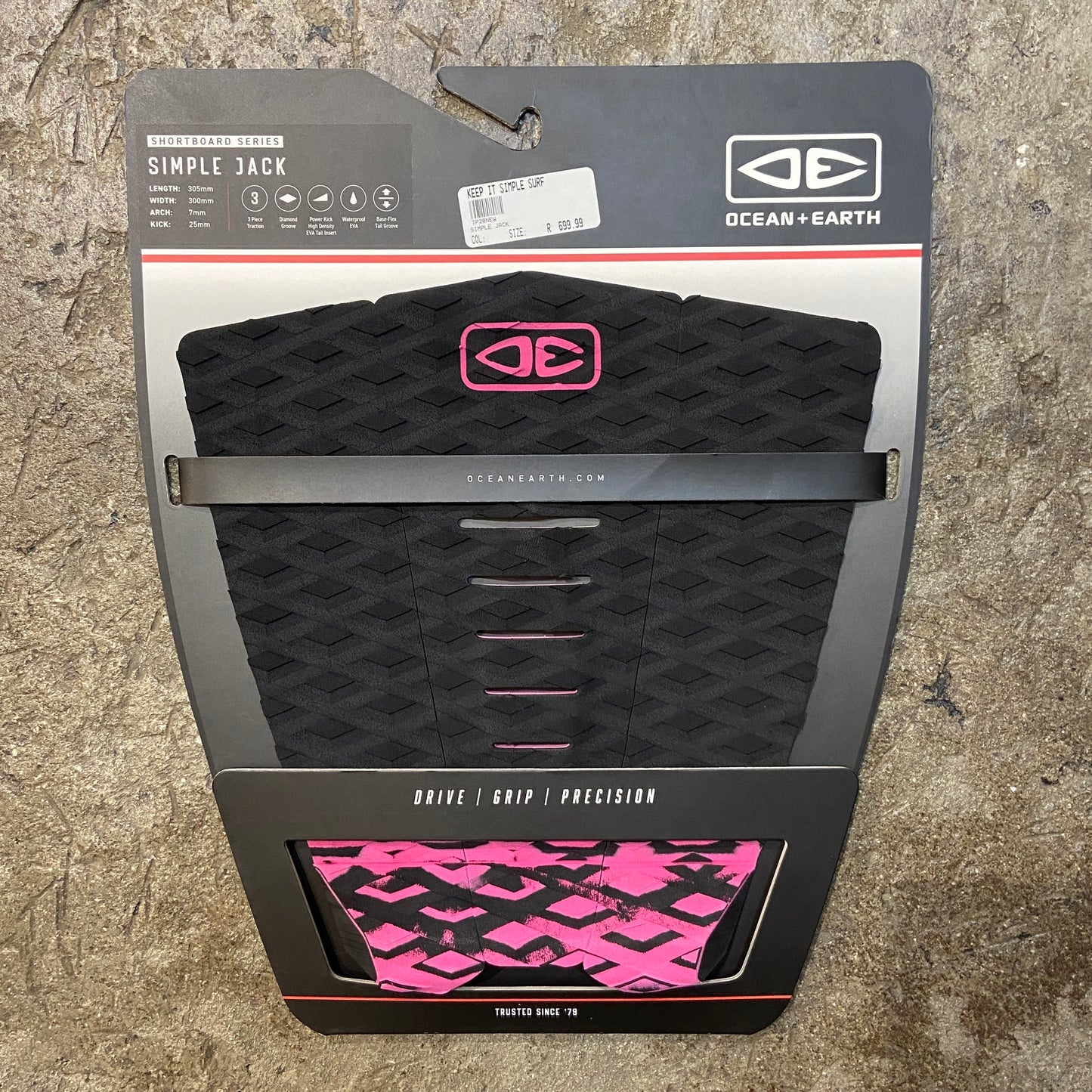 A black and pink three-piece traction pad for surfboards, branded with 'OCEAN&EARTH' on the packaging.