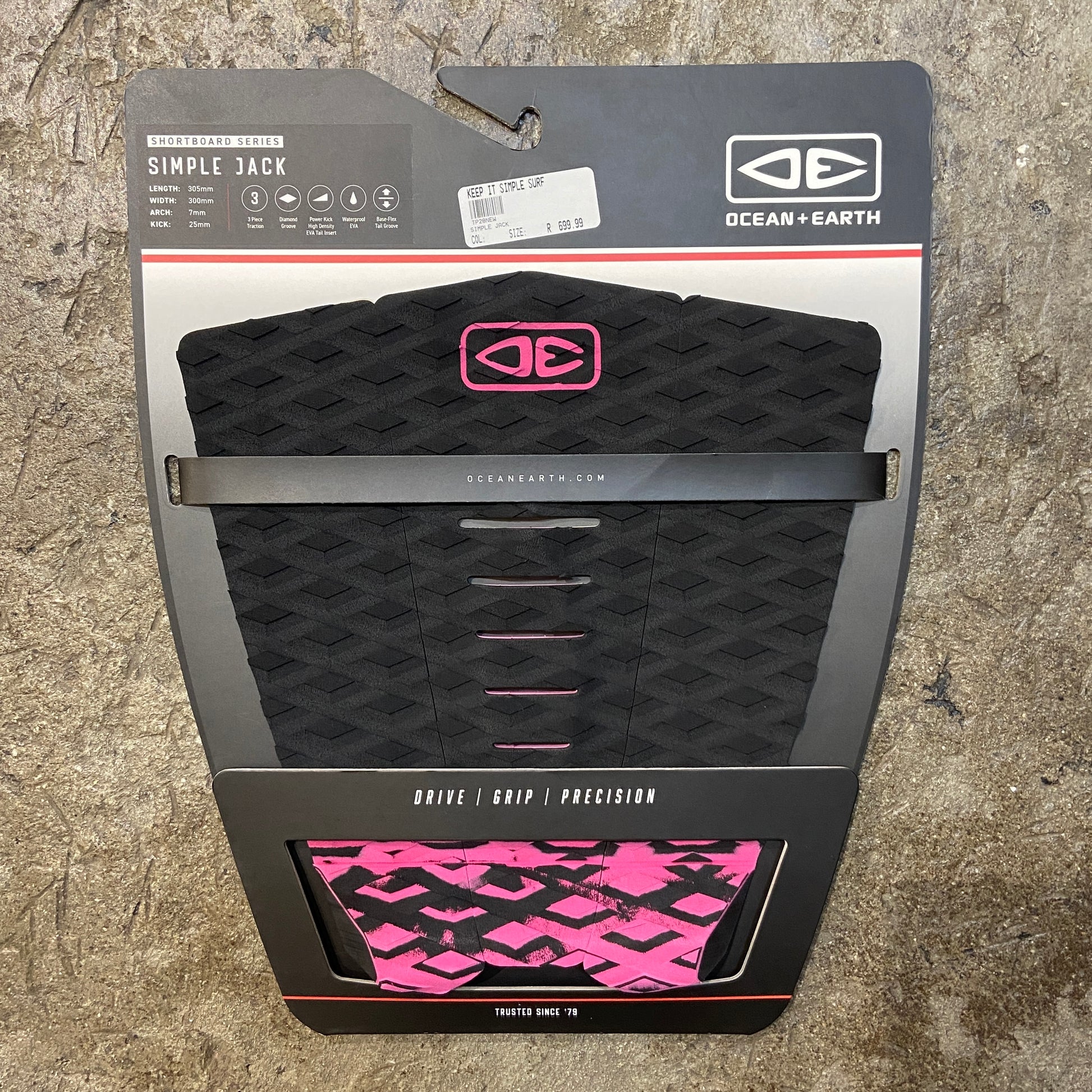 A black and pink three-piece traction pad for surfboards, branded with 'OCEAN&EARTH' on the packaging.