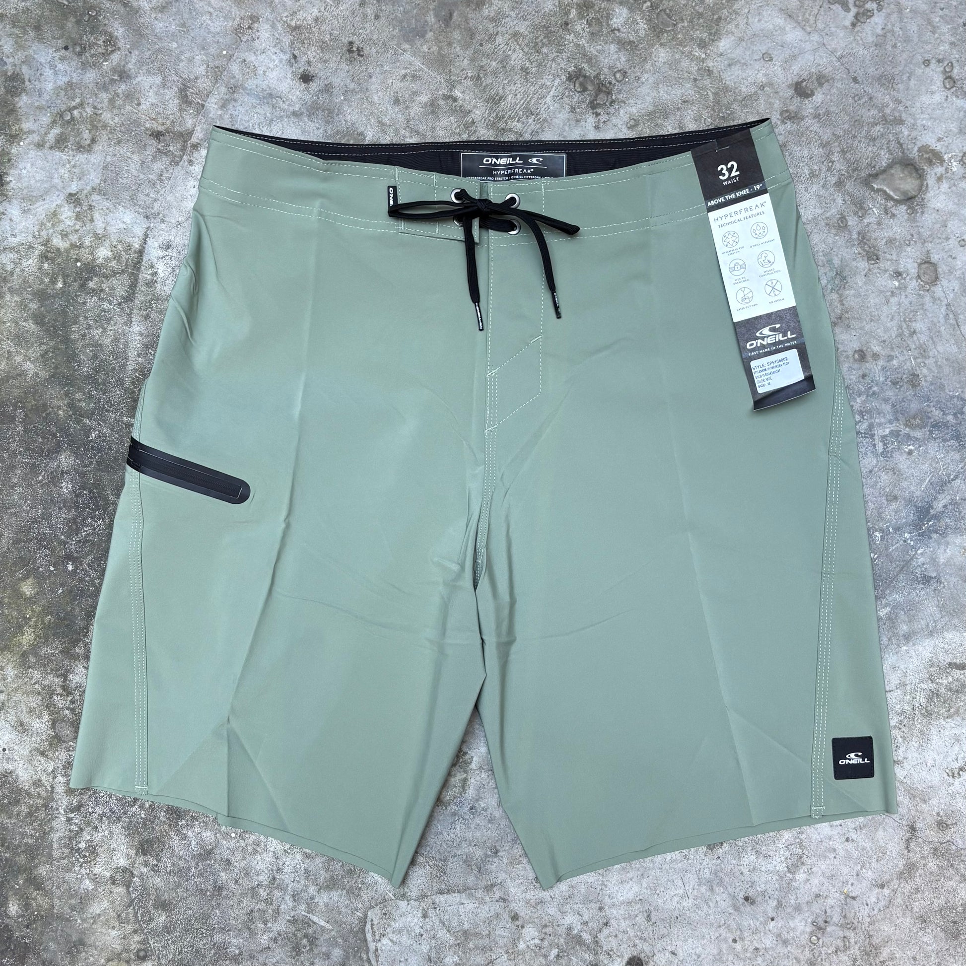 Green Hyperfreak board short on concrete floor