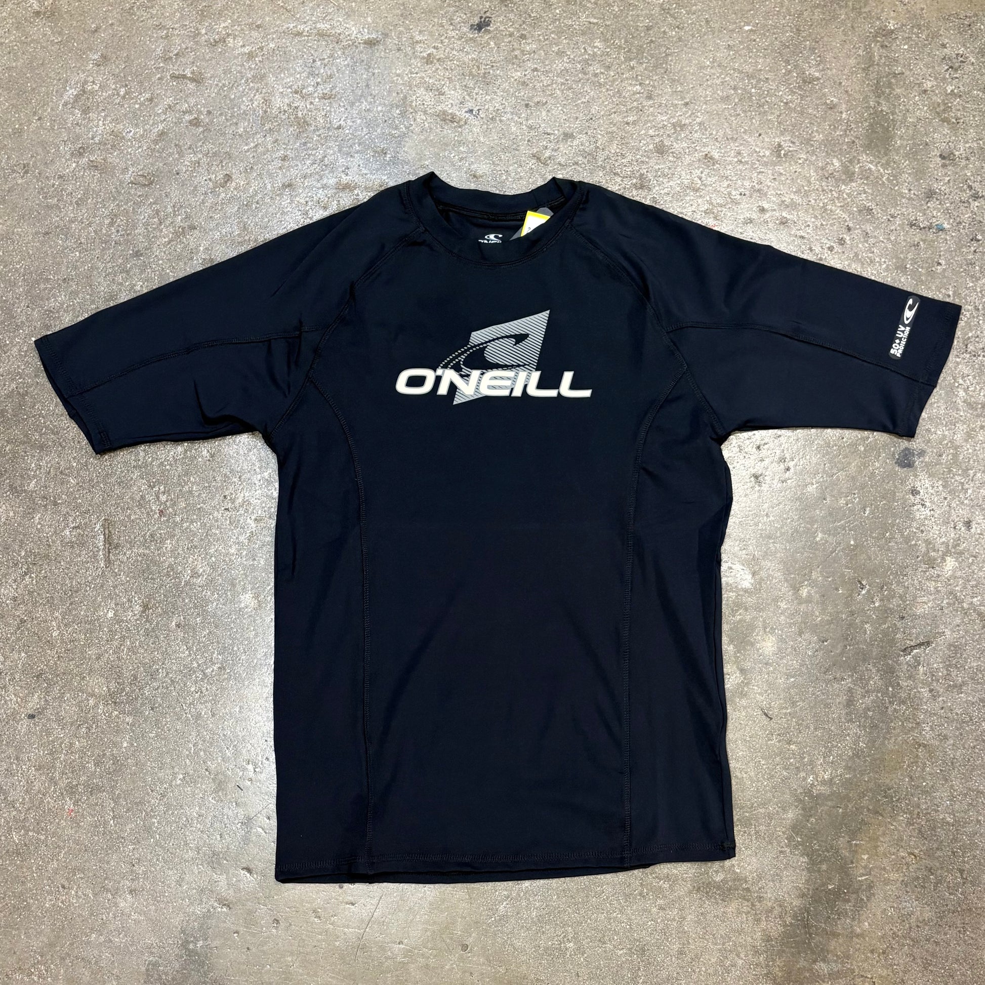 Black long-sleeve shirt with O'Neill logo on a concrete surface