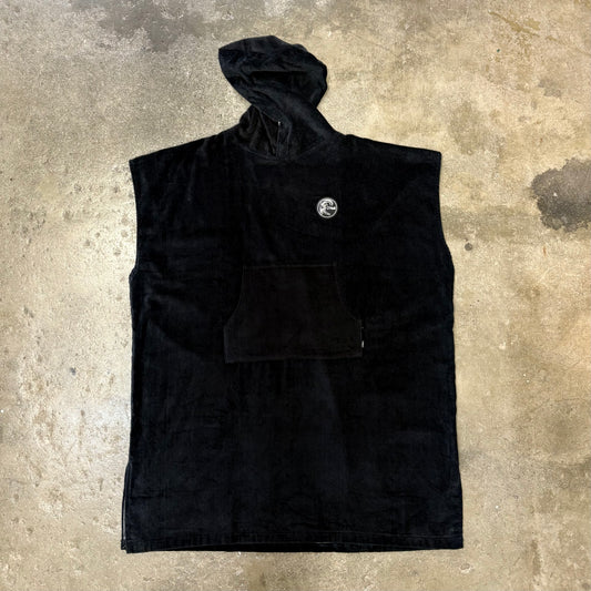 Black sleeveless jacket with a logo on a textured surface