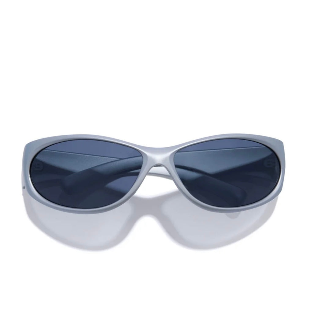 Silver sunglasses with dark lenses on a white background