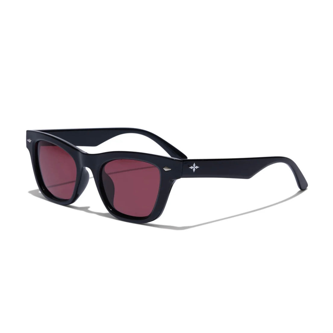 Black sunglasses with red lenses on a white background