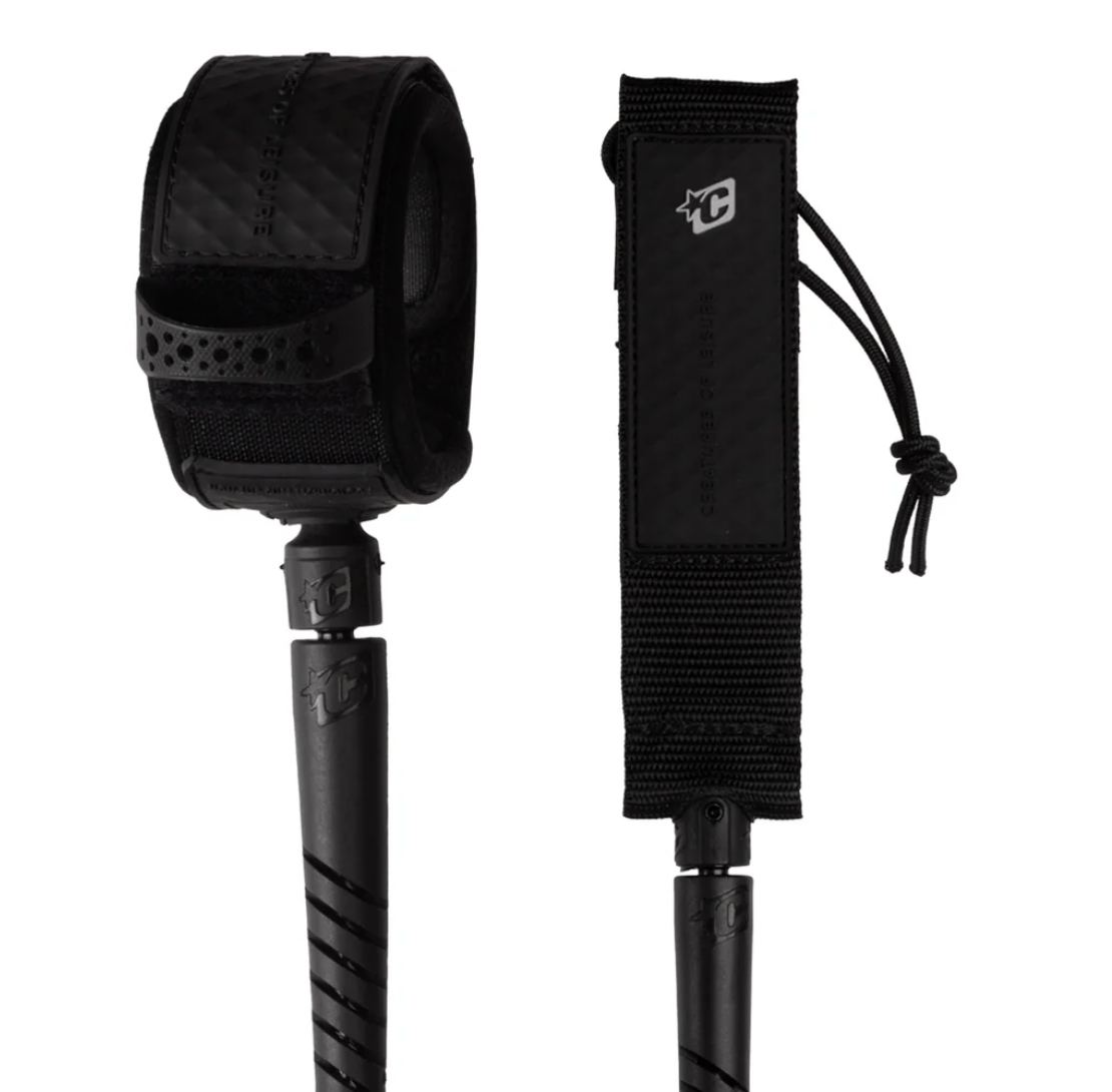 Black paddle leash with a strap and connector on a white background