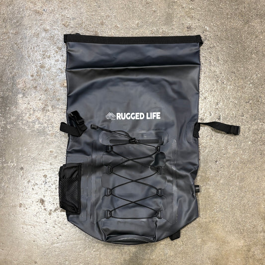 Rugged Life Dry & Compression Bag Backpack  in Heavy Duty Black on a concrete floor