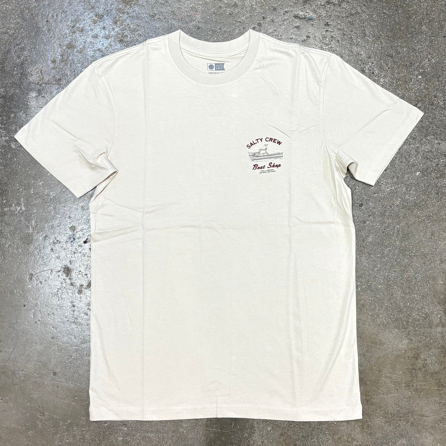 Front view of Salty Crew  Boat Shop Classic Tee on concrete floor
