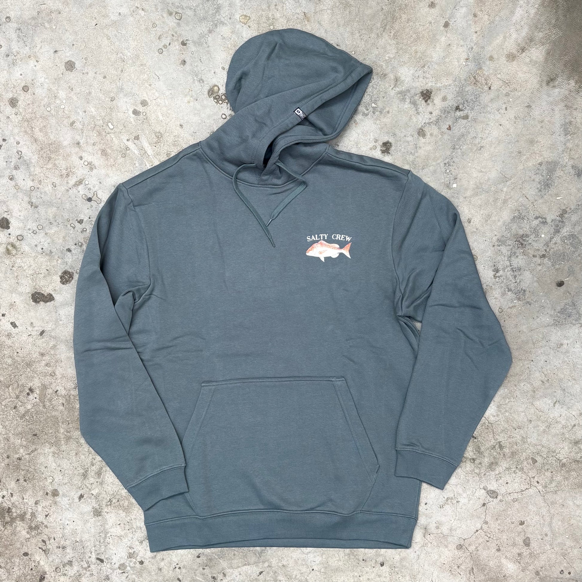 Blue hoodie with a logo on the chest against a textured concrete background