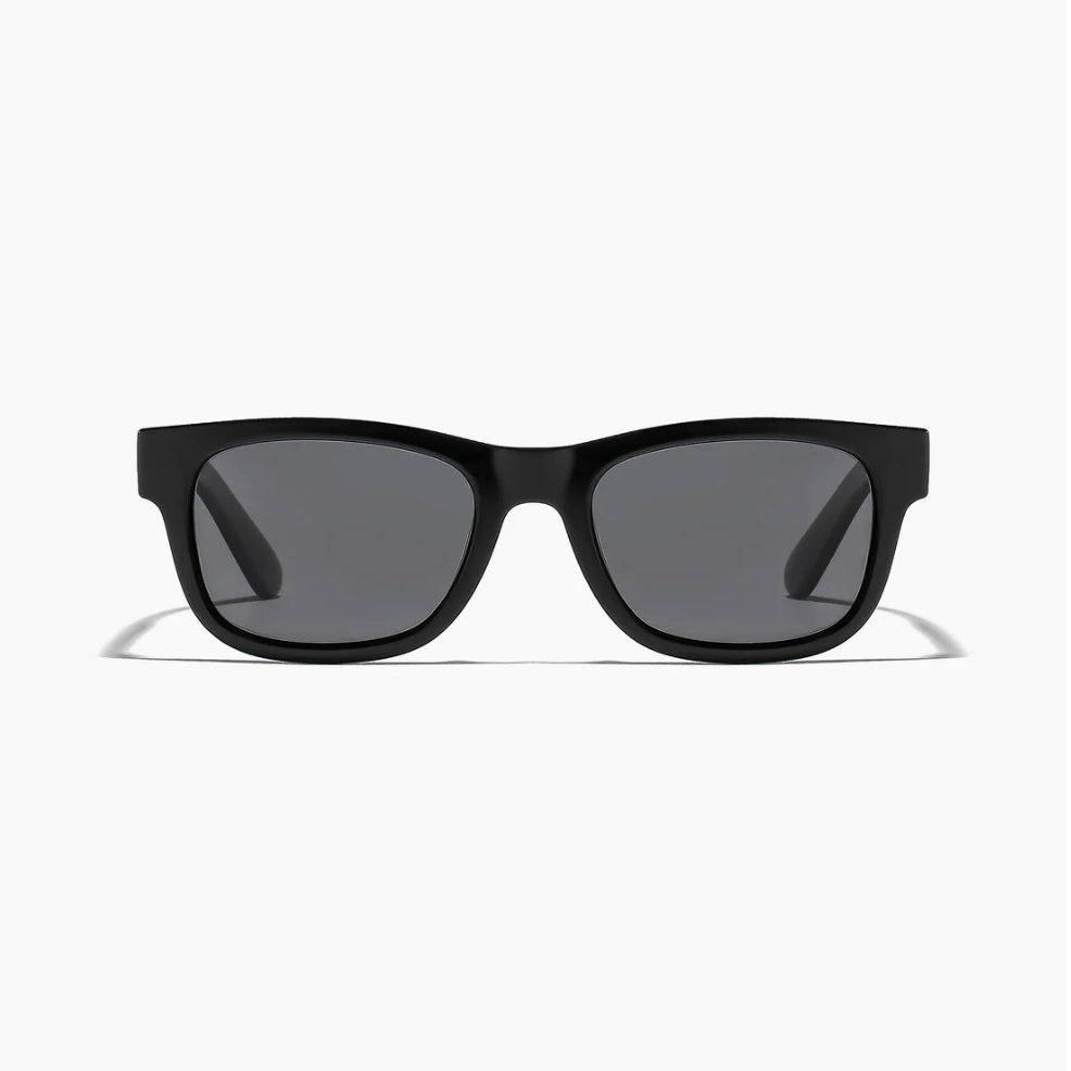 Black sunglasses with dark lenses on a white background