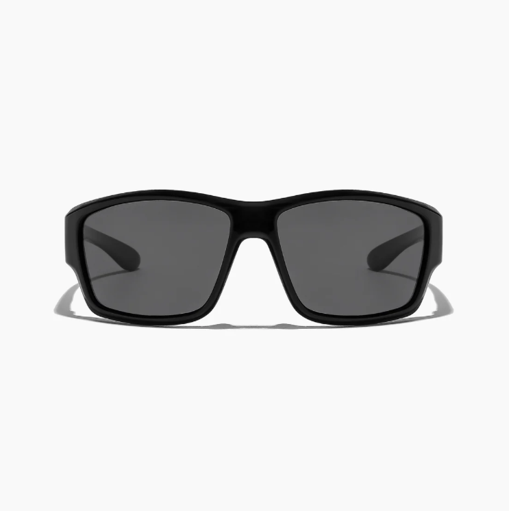 Black sunglasses with dark lenses on a white background