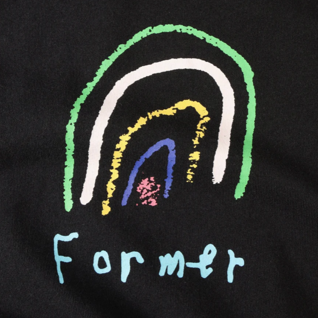 Black shirt with colorful rainbow design and 'Former' text on a dark background