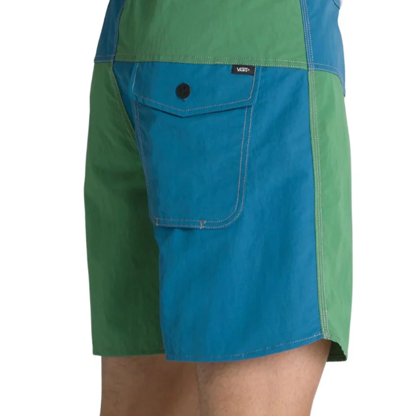 Green and blue shorts with a visible brand logo on a white background