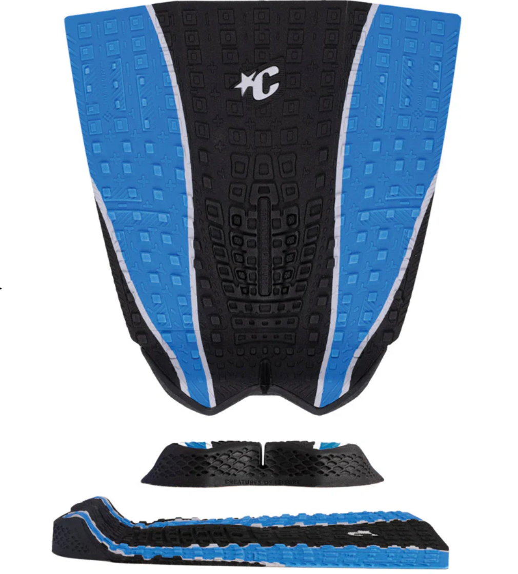 Black and blue surfboard tail pad with a brand logo on a white background